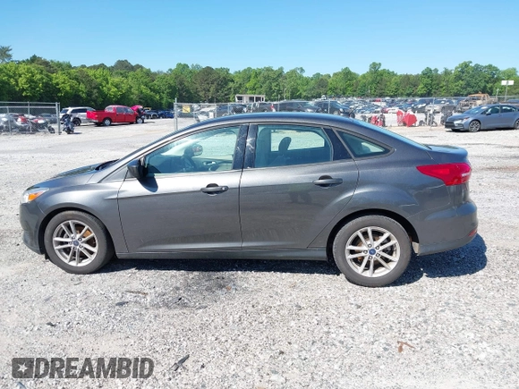 2018 Ford Focus SE z VIN 1FADP3FE1JL238012, wystawiony jako IAAI lot #42185232 z przebiegiem 143 687 mil mil oraz . Historia ofert i sprzedaży dostępna na DreamBid. Obrazek 14.