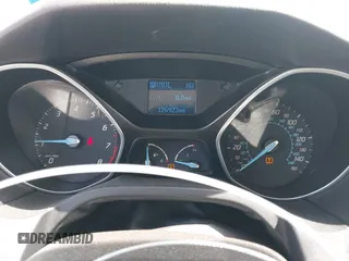 2012 Ford Focus SE z VIN 1FAHP3F22CL352952, wystawiony jako IAAI lot #42722671 z przebiegiem 126 923 mil mil oraz . Historia ofert i sprzedaży dostępna na DreamBid. Obrazek 7.