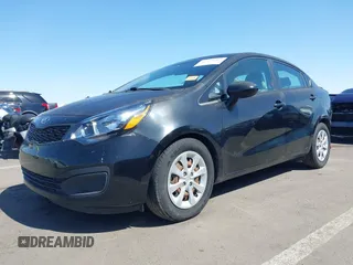 2014 Kia Rio LX with VIN KNADM4A39E6364490, listed as a IAAI auction lot 42128702 with 130,981 mi miles and . Bid and sale history available at DreamBid. Image 2.