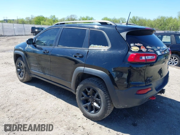 2018 Jeep Cherokee Trailhawk Leather Plus with VIN 1C4PJMBXXJD572667, listed as a IAAI auction lot 42216477 with 85,890 mi miles and . Bid and sale history available at DreamBid. Image 3.