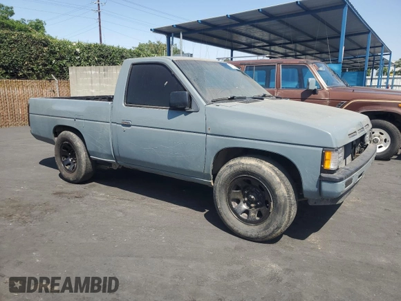 1990 Nissan Frontier with VIN 1N6SD11S9LC321876, listed as a Copart auction lot 59913575 with 119,909 mi miles and Salvage title. Bid and sale history available at DreamBid. Image 4.