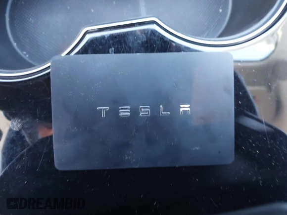 2018 Tesla Model 3 Long Range Battery with VIN 5YJ3E1EB9JF065057, listed as a IAAI auction lot 41863903 with 54,584 mi miles and . Bid and sale history available at DreamBid. Image 11.