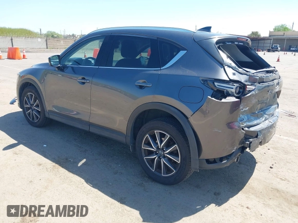 2017 Mazda CX-5 Grand Touring with VIN JM3KFADL6H0217850, listed as a IAAI auction lot 42033404 with 74,198 mi miles and . Bid and sale history available at carsss.com. Image 3.