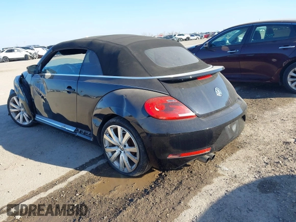 2014 Volkswagen Beetle 1.8T with VIN 3VW517AT4EM815243, listed as a IAAI auction lot 41245346 with 119,259 mi miles and . Bid and sale history available at DreamBid. Image 3.
