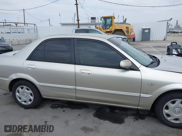 2002 Mazda Protege DX with VIN JM1BJ225121620394, listed as a IAAI auction lot 42043056 with 187,360 mi miles and . Bid and sale history available at DreamBid. Image 14.