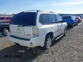 2006 GMC Envoy SLT with VIN 1GKDS13S062128531, listed as a IAAI auction lot 41458983 with 119,385 mi miles. Bid and sale history available at carsss.com. Image 4.
