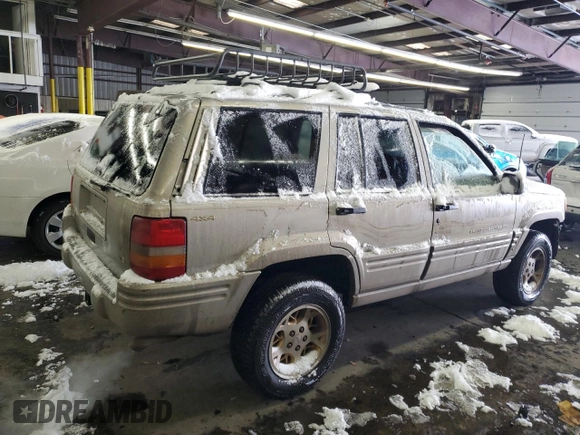 1997 Jeep Grand Cherokee Limited with VIN 1J4GZ78Y1VC706353, listed as a Copart auction lot 41437085 with 163,675 mi miles and Salvage Title. Bid and sale history available at carsss.com. Image 3.