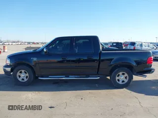 2002 Ford F-150 XLT with VIN 1FTRW07622KD31203, listed as a IAAI auction lot 41401506 with 166,949 mi miles. Bid and sale history available at carsss.com. Image 14.