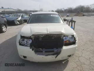 2005 Chrysler 300 with VIN 2C3JA43R25H663094, listed as a Copart auction lot 60813664 with 218,830 mi miles and Salvage Title. Bid and sale history available at carsss.com. Image 5.