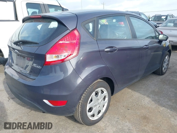 2013 Ford Fiesta SE with VIN 3FADP4EJ6DM205708, listed as a IAAI auction lot 42051721 with 139,143 mi miles. Bid and sale history available at carsss.com. Image 4.