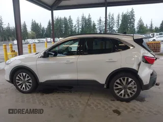 2020 Ford Escape Titanium Hybrid z VIN 1FMCU9DZ8LUA58350, wystawiony jako IAAI lot #41975564 z przebiegiem 38 387 mil mil oraz . Historia ofert i sprzedaży dostępna na DreamBid. Obrazek 14.