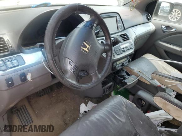 2010 Honda Odyssey EX-L с VIN 5FNRL3H76AB091537, выставлен на аукционе Copart как лот 60861615 с пробегом Не указан миль и Чистый • Clean title. История ставок и продаж доступна на DreamBid. Изображение 8.