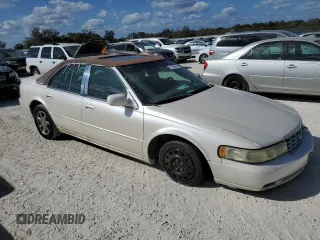 2003 Cadillac Seville Luxury SLS z VIN 1G6KS54Y03U289834, wystawiony jako Copart lot #77362694 z przebiegiem Nie podano mil oraz Szkoda całkowita • Salvage title. Historia ofert i sprzedaży dostępna na DreamBid. Obrazek 4.