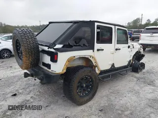 2014 Jeep Wrangler Unlimited Sahara with VIN 1C4BJWEG0EL151473, listed as a IAAI auction lot 41600726 with 119,057 mi miles. Bid and sale history available at carsss.com. Image 4.