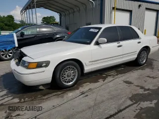 2000 Mercury Grand Marquis GS z VIN 2MEFM74WXYX699560, wystawiony jako Copart lot #57721925 z przebiegiem 246 297 mil mil oraz Szkoda całkowita • Salvage title. Historia ofert i sprzedaży dostępna na DreamBid. Obrazek 1.