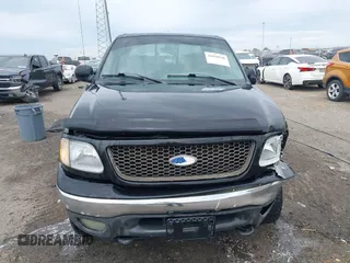 2002 Ford F-150 XLT with VIN 1FTRW08L32KD90202, listed as a IAAI auction lot 41850546 with 256,807 mi miles. Bid and sale history available at carsss.com. Image 12.