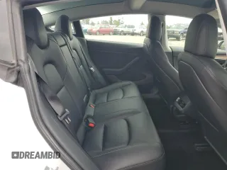 2021 Tesla Model 3 Standard Range Plus with VIN 5YJ3E1EA7MF087909, listed as a Copart auction lot 50942395 with 16,591 mi miles and Salvage Title. Bid and sale history available at carsss.com. Image 10.