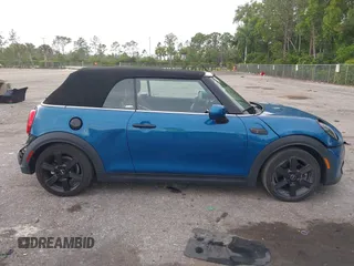 2022 MINI Convertible Cooper S z VIN WMW43DL06N3P19784, wystawiony jako IAAI lot #42635816 z przebiegiem 17 053 mil mil oraz . Historia ofert i sprzedaży dostępna na DreamBid. Obrazek 14.