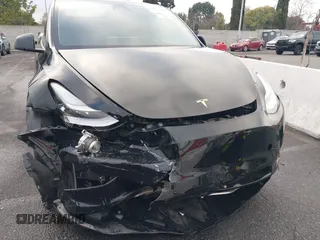 2023 Tesla Model Y Long Range with VIN 7SAYGDEE2PA024032, listed as a IAAI auction lot 41213403 with 23,418 mi miles and . Bid and sale history available at DreamBid. Image 12.