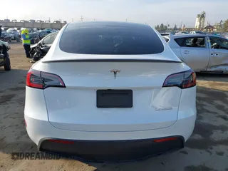 2023 Tesla Model Y Performance with VIN 7SAYGDEF0PF839468, listed as a IAAI auction lot 41609263 with 25,434 mi miles and . Bid and sale history available at DreamBid. Image 17.