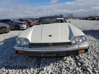 1989 Jaguar XJS z VIN SAJNV4847KC164497, wystawiony jako Copart lot #87258504 z przebiegiem 90 299 mil mil oraz Szkody całkowita. Historia ofert i sprzedaży dostępna na DreamBid. Obrazek 5.