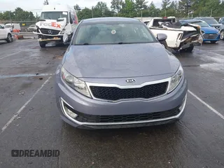 2011 Kia Optima EX Hybrid z VIN KNAGM4AD8B5002951, wystawiony jako IAAI lot #42462401 z przebiegiem 198 079 mil mil oraz . Historia ofert i sprzedaży dostępna na DreamBid. Obrazek 6.