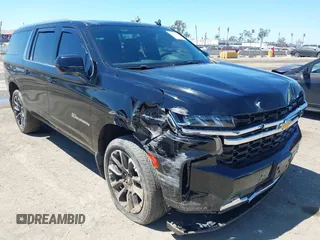 2023 Chevrolet Suburban LS z VIN 1GNSCBKD3PR457569, wystawiony jako IAAI lot #42225571 z przebiegiem 53 410 mil mil oraz . Historia ofert i sprzedaży dostępna na DreamBid. Obrazek 1.