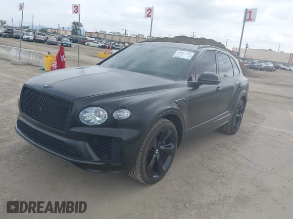 2021 Bentley Bentayga V8 z VIN SJAAM2ZV5MC038171, wystawiony jako IAAI lot #42057762 z przebiegiem 25 973 mil mil oraz . Historia ofert i sprzedaży dostępna na DreamBid. Obrazek 2.