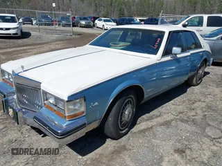 1981 Cadillac Seville z VIN 1G6AS6998BE684808, wystawiony jako IAAI lot #41778889 z przebiegiem 48 084 mil mil oraz . Historia ofert i sprzedaży dostępna na DreamBid. Obrazek 2.