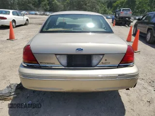 1999 Ford Crown Victoria LX z VIN 2FAFP74W1XX122364, wystawiony jako Copart lot #56929455 z przebiegiem 118 134 mil mil oraz Szkody całkowita. Historia ofert i sprzedaży dostępna na DreamBid. Obrazek 6.