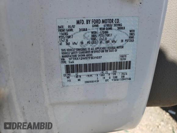 2007 Ford F-150 STX with VIN 1FTRX12W57FB31037, listed as a Copart auction lot 50779865 with 262,572 mi miles and Salvage Title. Bid and sale history available at DreamBid. Image 12.