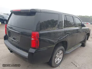 2017 Chevrolet Tahoe Commercial with VIN 1GNLCDECXHR304319, listed as a IAAI auction lot 41924011 with 130,566 mi miles. Bid and sale history available at carsss.com. Image 4.