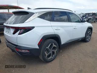2022 Hyundai Tucson SEL z VIN 5NMJF3AE2NH062926, wystawiony jako IAAI lot #41969902 z przebiegiem 41 882 mil mil oraz . Historia ofert i sprzedaży dostępna na DreamBid. Obrazek 4.