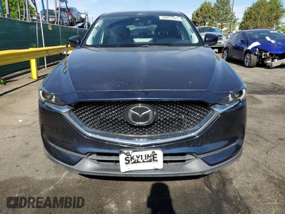 2021 Mazda CX-5 Grand Touring with VIN JM3KFBDM3M1344784, listed as a Copart auction lot 58051445 with 69,593 mi miles and Salvage title. Bid and sale history available at DreamBid. Image 5.