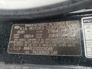 2005 Kia Spectra LX with VIN KNAFE121055134568, listed as a Copart auction lot 71541244 with 146,751 mi miles and Salvage Title. Bid and sale history available at carsss.com. Image 14.
