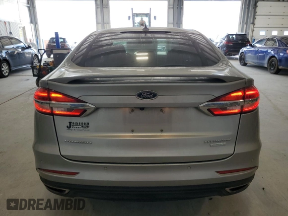 2020 Ford Fusion Titanium с VIN 3FA6P0K90LR112034, выставлен на аукционе Copart как лот 56740025 с пробегом 89 117 миль миль и Списание • Salvage title. История ставок и продаж доступна на DreamBid. Изображение 6.