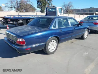 2000 Jaguar XJ with VIN SAJDA14C4YLF16529, listed as a IAAI auction lot 41387819 with 90,143 mi miles. Bid and sale history available at carsss.com. Image 4.