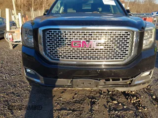 2016 GMC Yukon Denali with VIN 1GKS2CKJ2GR412201, listed as a IAAI auction lot 41185716 with 124,421 mi miles. Bid and sale history available at carsss.com. Image 6.