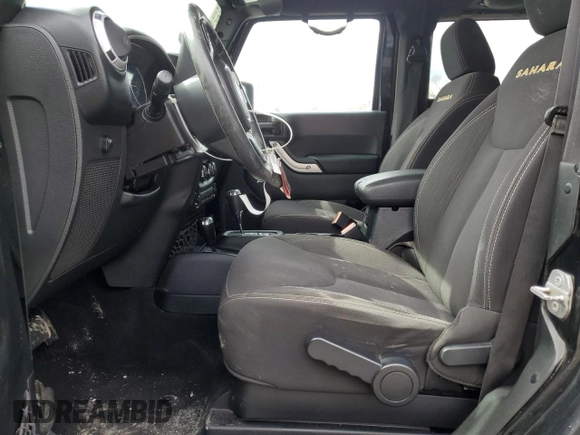 2014 Jeep Wrangler Sahara with VIN 1C4AJWBG0EL306703, listed as a Copart auction lot 51450215 with 115,932 mi miles and Salvage Title. Bid and sale history available at DreamBid. Image 7.