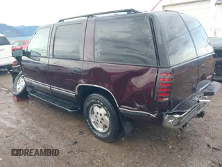 1997 GMC Yukon with VIN 1GKEK13R0VJ755574, listed as a IAAI auction lot 41158932 with 212,668 mi miles. Bid and sale history available at carsss.com. Image 3.