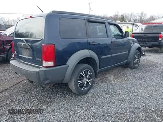 2008 Dodge Nitro SXT with VIN 1D8GU28K18W165005, listed as a IAAI auction lot 41904859 with 171,029 mi miles. Bid and sale history available at carsss.com. Image 4.