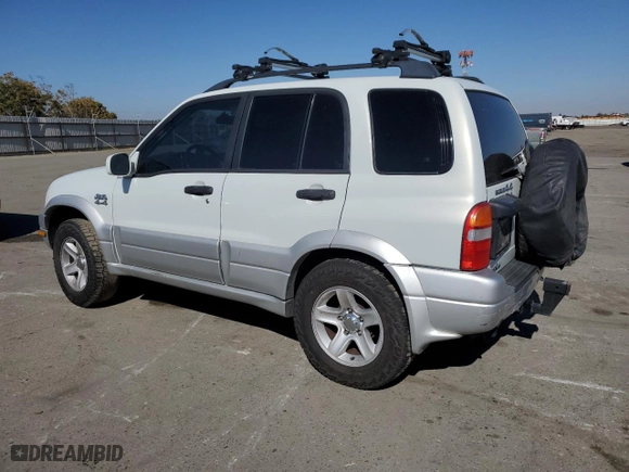 2003 Suzuki Grand Vitara with VIN JS3TD62V734102584, listed as a Copart auction lot 77210564 with 148,477 mi miles and Salvage Title. Bid and sale history available at carsss.com. Image 2.