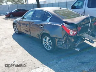 2015 Infiniti Q50 Premium z VIN JN1BV7AR3FM396882, wystawiony jako IAAI lot #37523335 z przebiegiem 89 761 mil mil oraz . Historia ofert i sprzedaży dostępna na DreamBid. Obrazek 6.