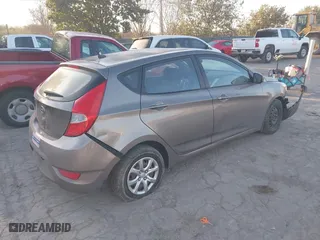 2014 Hyundai Accent GS with VIN KMHCT5AE6EU165851, listed as a IAAI auction lot 41313636 with 161,054 mi miles. Bid and sale history available at carsss.com. Image 4.