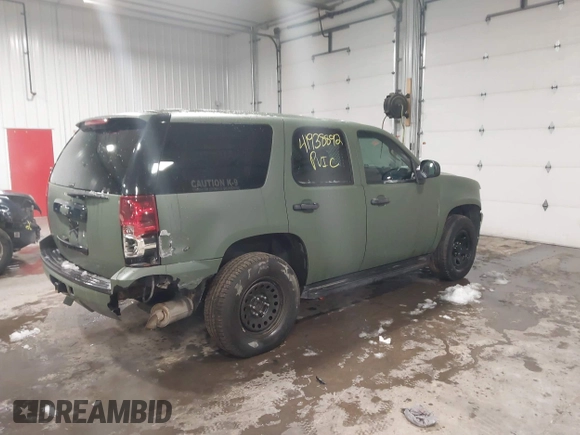 2014 Chevrolet Tahoe Commercial with VIN 1GNSK2E05ER196941, listed as a IAAI auction lot 41938892 with 176,170 mi miles and . Bid and sale history available at DreamBid. Image 4.
