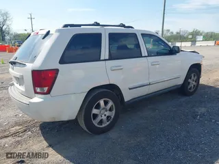 2010 Jeep Grand Cherokee Laredo with VIN 1J4PS4GK6AC112447, listed as a IAAI auction lot 42086245 with 150,875 mi miles. Bid and sale history available at carsss.com. Image 4.