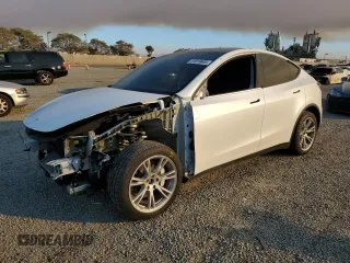 2023 Tesla Model Y Long Range with VIN 7SAYGDEE9PA129876, listed as a Copart auction lot 41819605 with 36,110 mi miles and Salvage Title. Bid and sale history available at DreamBid. Image 1.