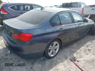2015 BMW 3 Series 328i with VIN WBA3A5G55FNS90446, listed as a IAAI auction lot 41828658 with 124,867 mi miles. Bid and sale history available at carsss.com. Image 4.