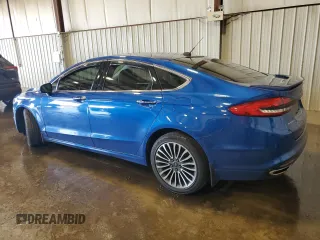 2017 Ford Fusion Titanium z VIN 3FA6P0D99HR162354, wystawiony jako Copart lot #61753395 z przebiegiem 100 678 mil mil oraz Szkoda całkowita • Salvage title. Historia ofert i sprzedaży dostępna na DreamBid. Obrazek 2.