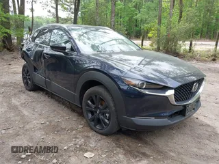 2023 Mazda CX-30 Premium with VIN 3MVDMBDY0PM566361, listed as a IAAI auction lot 42080902 with 6,938 mi miles and . Bid and sale history available at DreamBid. Image 1.